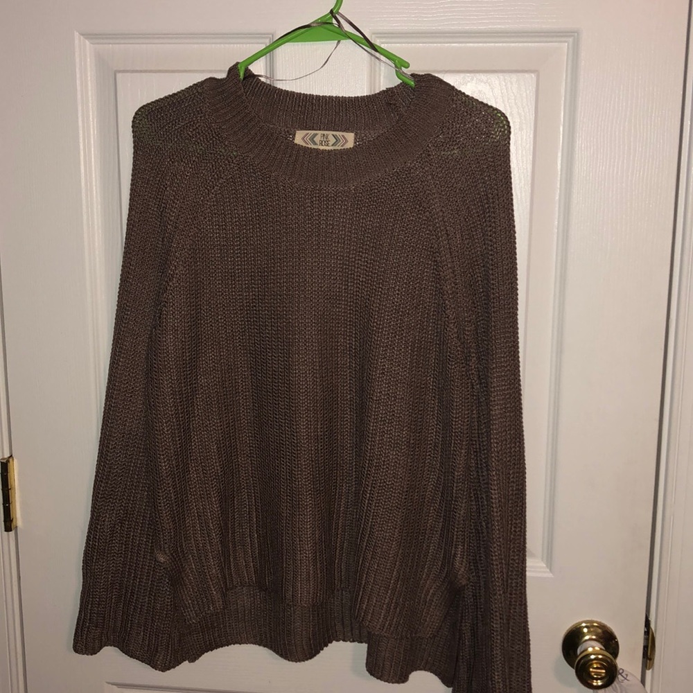 A size large “pink rose” sweater